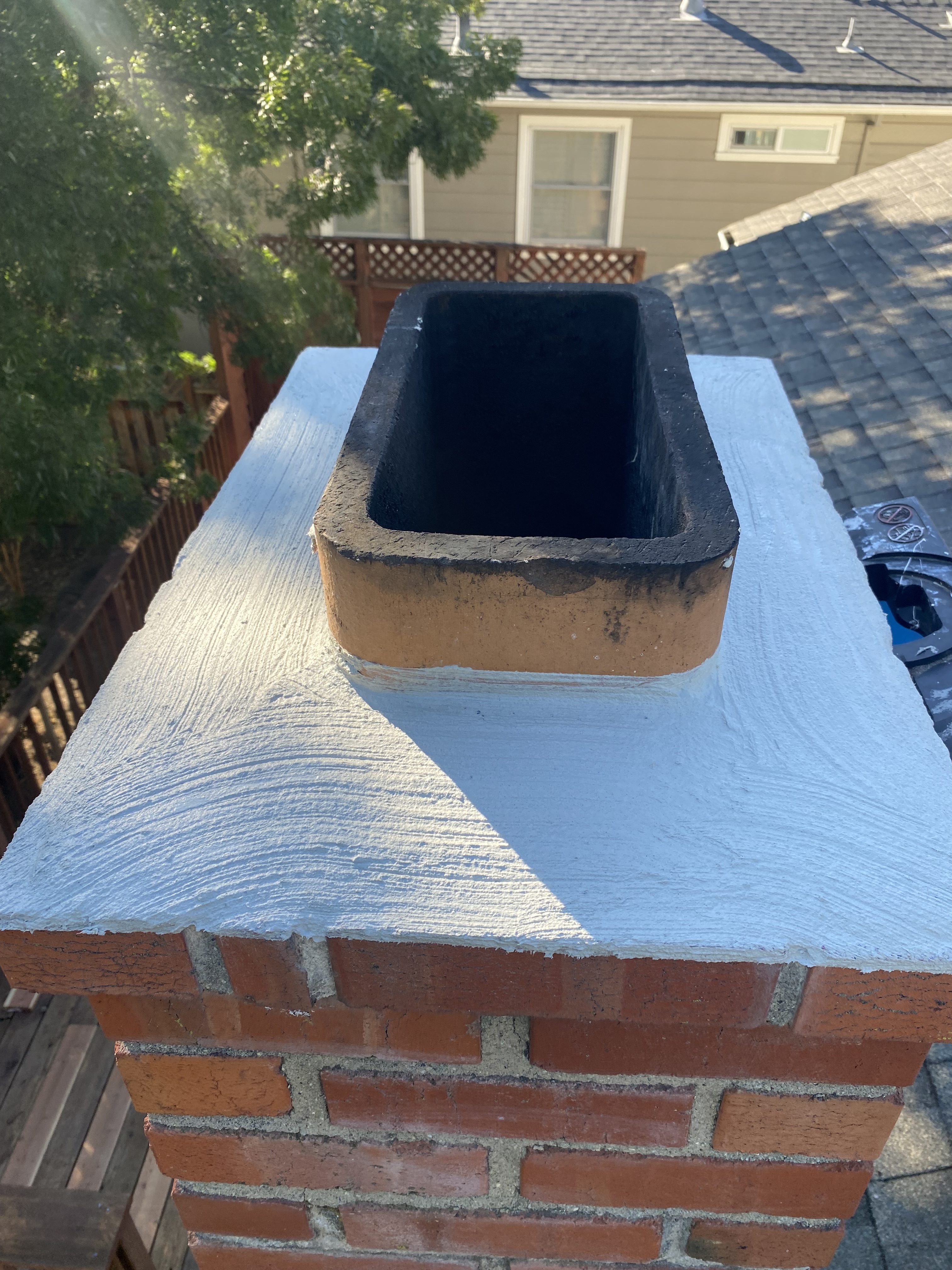 Chimney crown work, aerial rooftop view