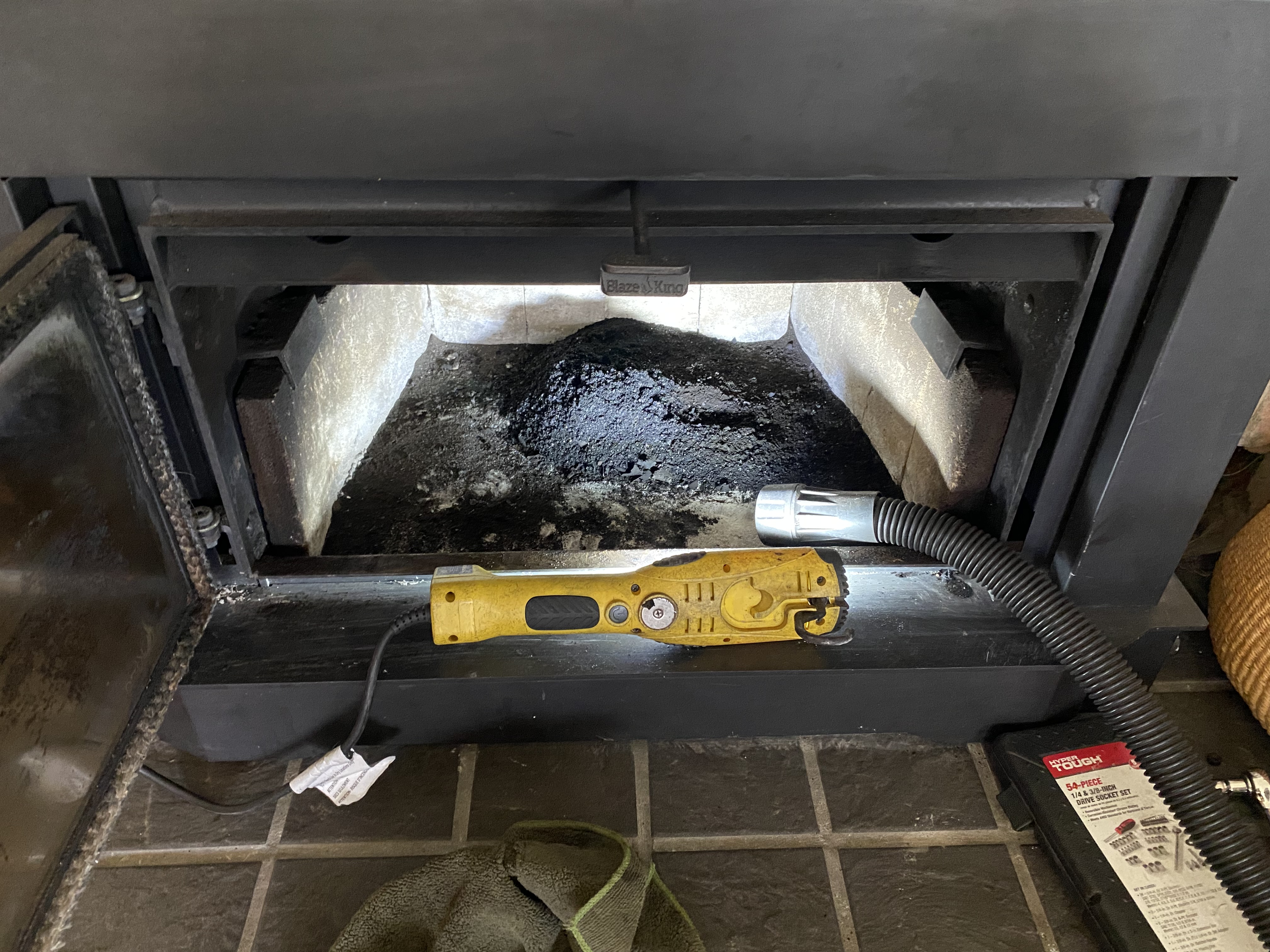 Fireplace interior with professional cleaning equipment